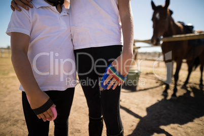 Siblings standing together in ranch