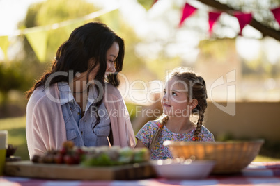 Mother and daughter enjoying together in the park