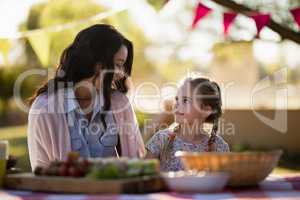 Mother and daughter enjoying together in the park