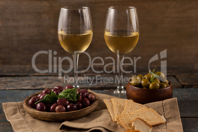White wine with olives served in container