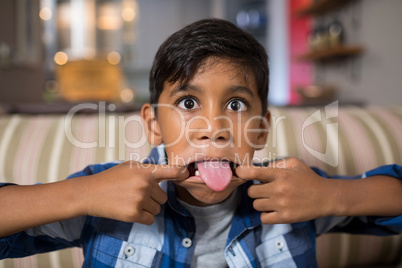 Close  up portrait of boy teasing