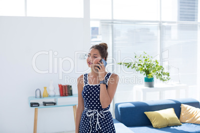 Female executive talking on mobile phone