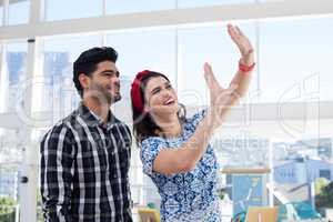 Couple interacting with each other in the office