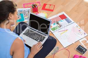 Graphic designer using laptop in the office