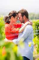Couple embracing at vineyard