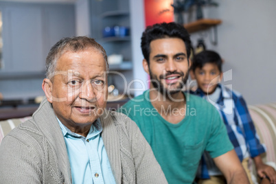 Close up portrait of family in living room