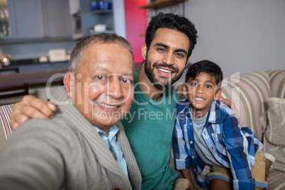 Close up of smiling family with arm around