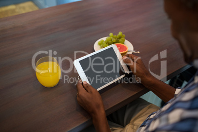 Cropped image of man using tablet