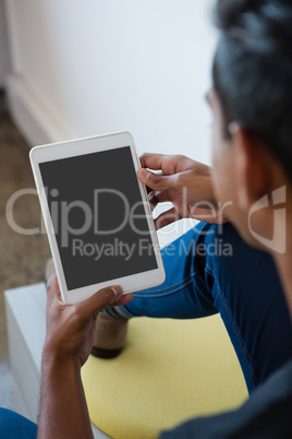 Man using digital tablet at office