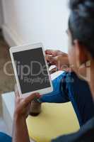 Man using digital tablet at office