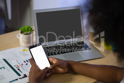 Cropped image of man using phone in office
