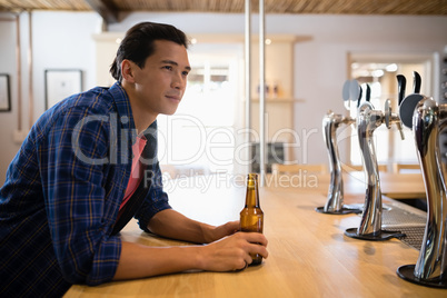 Man having beer at counter