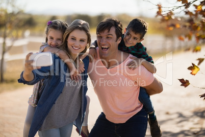 Family taking a selfie in the park