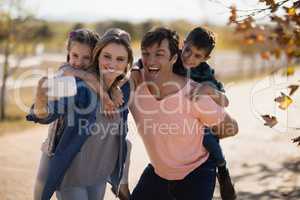 Family taking a selfie in the park