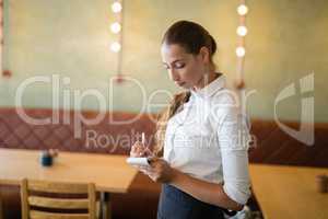 Waitress taking an order on notepad