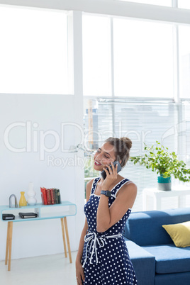 Female executive talking on mobile phone