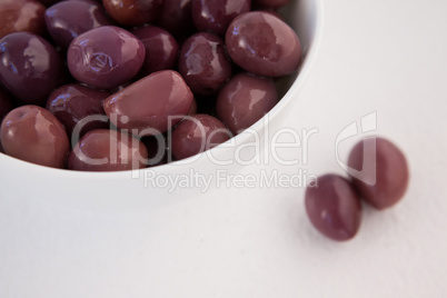 Cropped image of brown olives in bowl