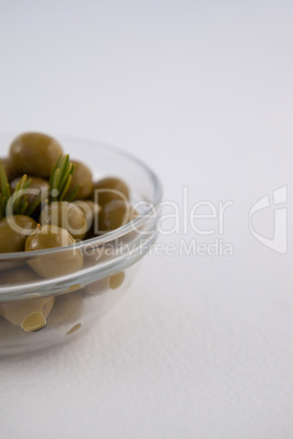 Green olives in glass bowl