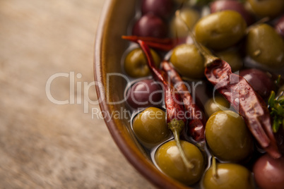 Close up of olives with red chili pepper