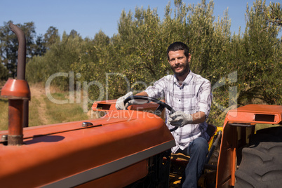 Portrait of man sitting in tractor