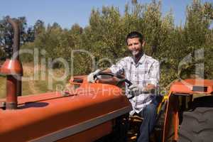 Portrait of man sitting in tractor