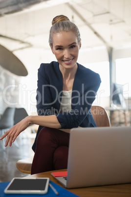 Portrait of businesswoman sitting in office