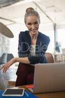 Portrait of businesswoman sitting in office