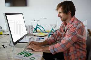 Young businessman using computer