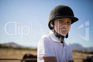 Girl smiling at camera in the ranch