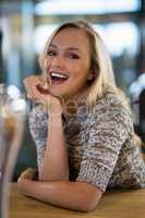 Beautiful woman sitting at bar counter