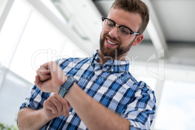 Male executive using smartwatch