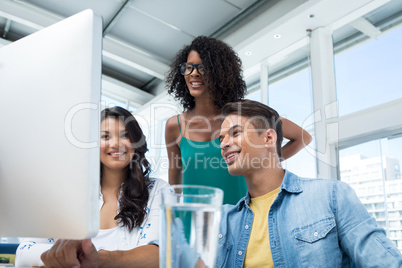 Executives working on computer in the office