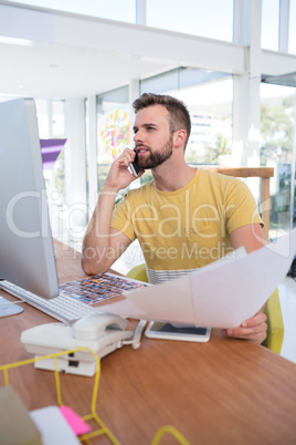 Male executive talking on mobile phone Male executive talking on mobile phone