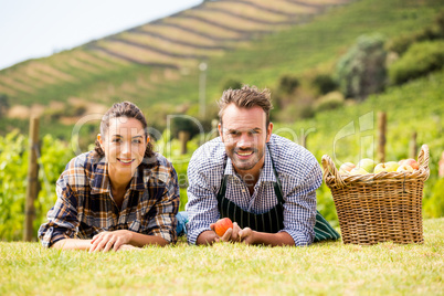 Portrait of couple lying down at vineyard