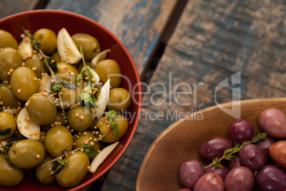Cropped image of olives served in containers