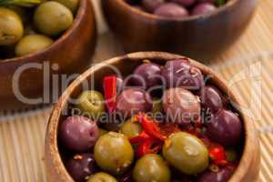 High angle view of olives in wooden container