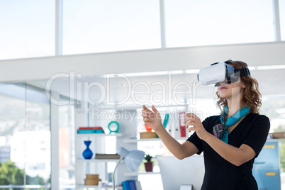 Female executive using virtual reality headset