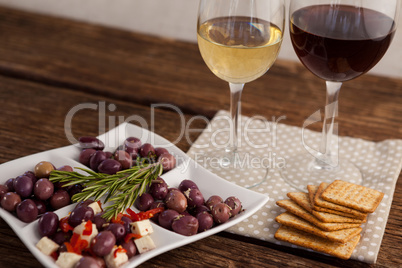 High angle view of olives served with wine