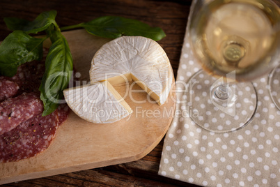 Close up of cheese with meat on table