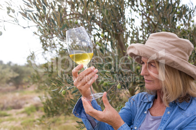 Woman looking at glass of wine