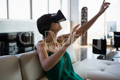 Woman using virtual reality simulator at office Woman using virtual reality simulator at office