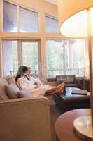 Couple relaxing while having coffee in the living room