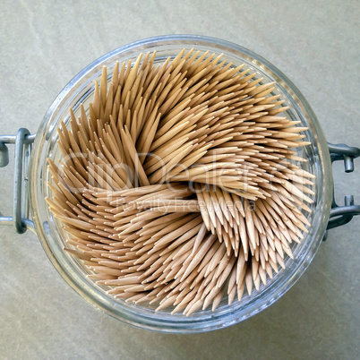 group of toothpicks in a glass jar