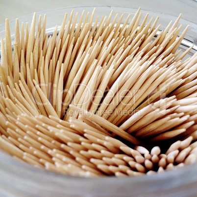 group of bamboo toohtpicks in a glass jar