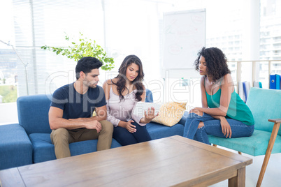 Executives using digital tablet in the office