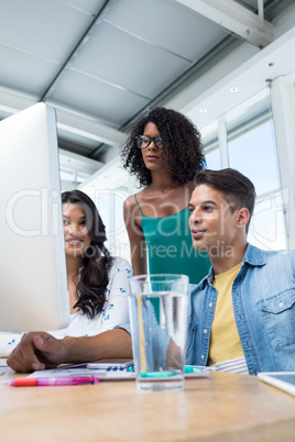 Executives working on computer in the office