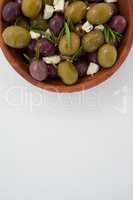 Overhead view of olives with herbs and cheese