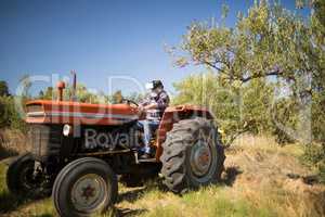 Man using virtual reality headset in tractor