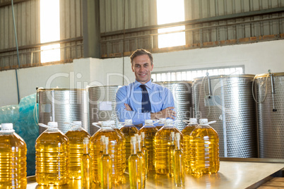 Portrait of manager standing with arms crossed