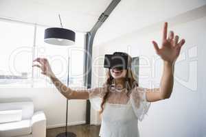 Smiling businesswoman wearing virtual reality simulator